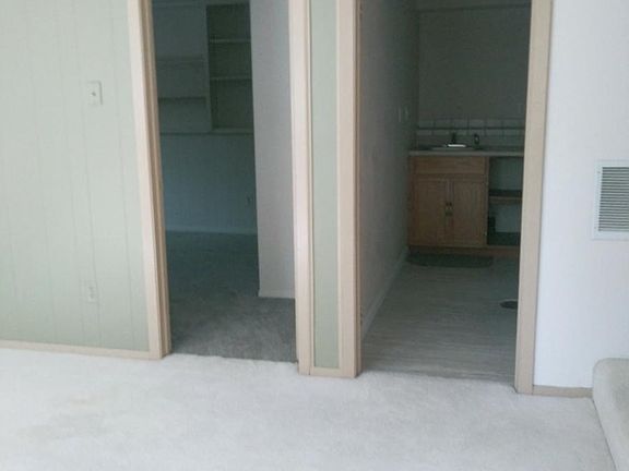 View into kitchenette and bedroom.