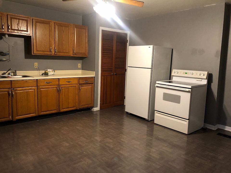This kitchen is big. Great pantry in the corner. Pantry is lined with shelves.