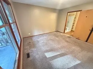 Bedroom #2 with walk-in shower.