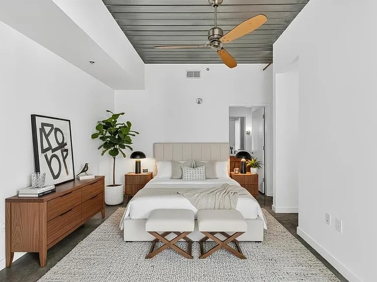 Large bedroom with high loft steel ceilings