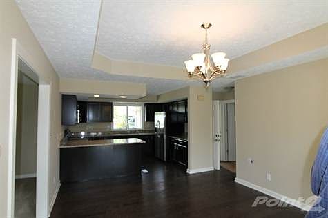 Dining and kitchen combine with new hardwood floors.