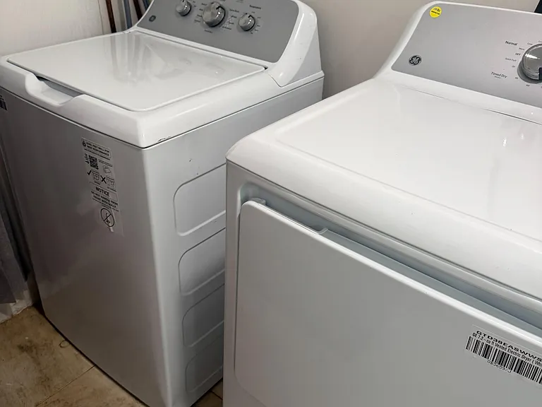 Dedicated laundry area with a full-size washer and dryer for convenient in-home laundry and easy routine upkeep.
