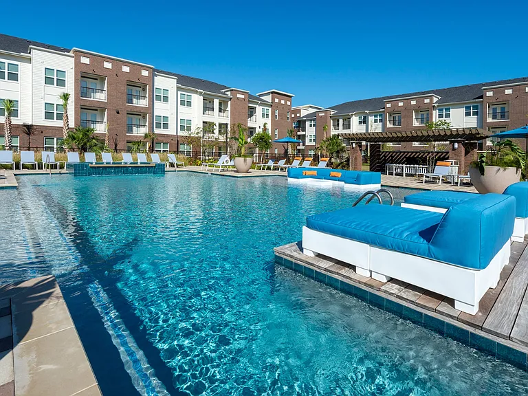 Resort-style pool with lounge seating