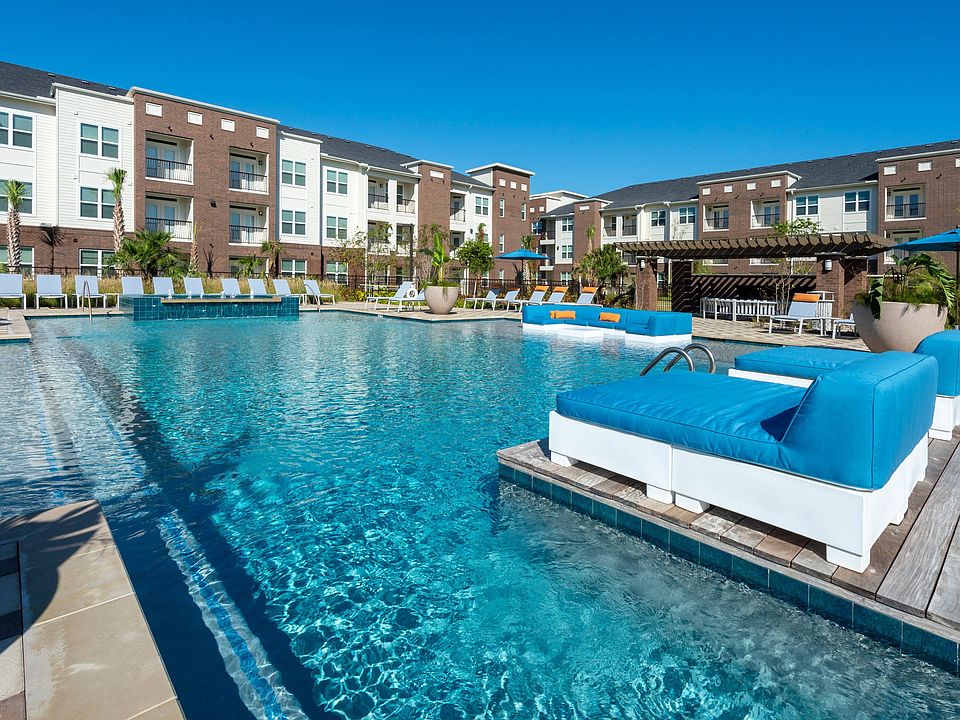 Resort-style pool with lounge seating