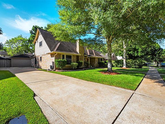 Street view side facing including detached 2.5 car garage.