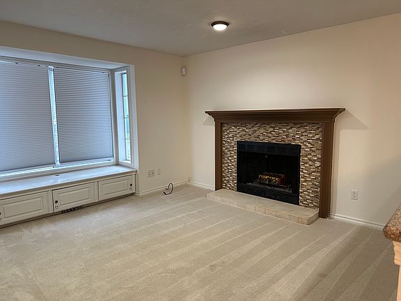 New Carpet in Living Room with Fireplace