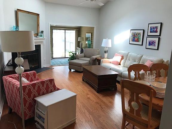 Living room with partial view of sunroom.