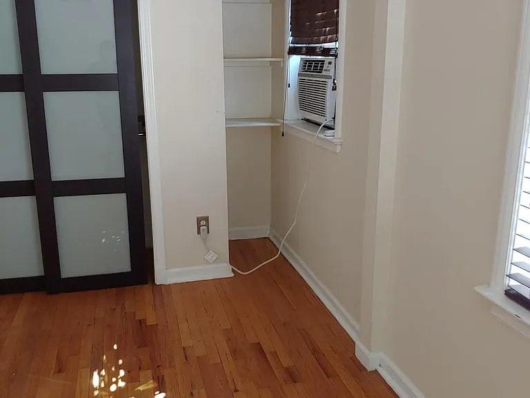 A/C cools entire unit. Shelves, modern closet doors and fixtures.