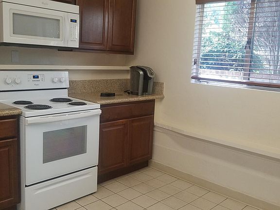Easy care tile floors in kitchen. Newer Kitchen window & screen with natural lighting.