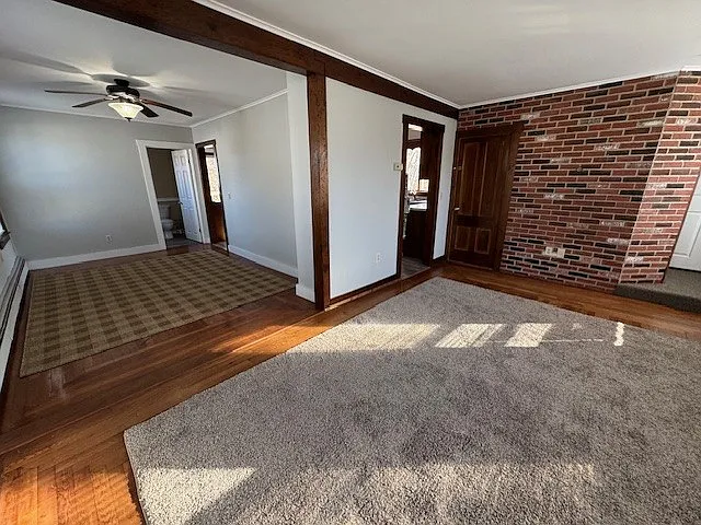 View from living room looking to left to dining room and right doorway accesses kitchen