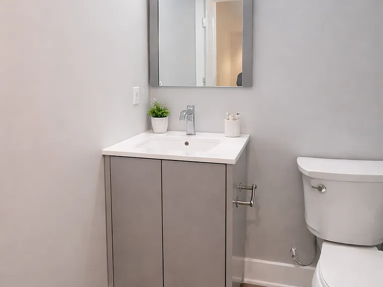 bedroom 2- ensuite bathroom - vanity and toilet