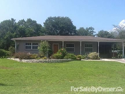 Front Yard and front of House
						:
						House overlooks acreage on the edge of well maintained subdivision