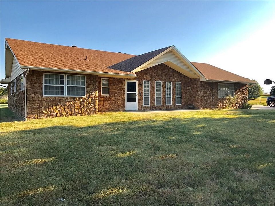 Four bedrooms, three baths updated roof, hvac, some windows and a 30x50 shop.