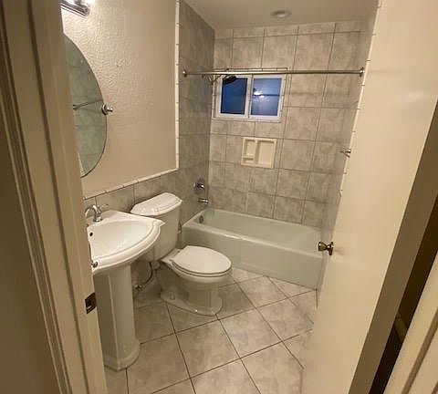 Secondary bath, new mirrors and door knobs being installed.