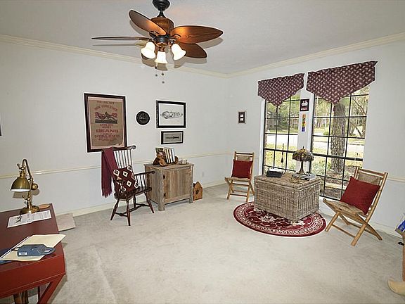 Features Crown Molding, Updated Lighting, Great Views out Large Windows.
