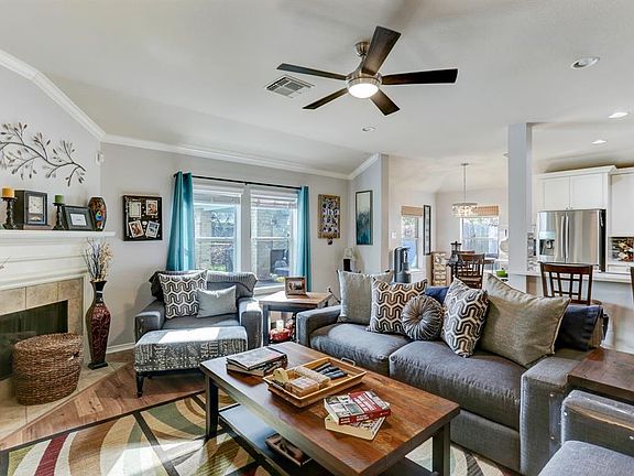 Living room is in direct view of the kitchen and breakfast room.