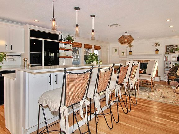 Beautiful, newly renovated, open-concept kitchen with commercial size refrigerator / freezer and 4 person breakfast bar. Kitchen is fully stocked with pots, pans, utensils, dishes, glassware, dishwasher, disposal, electric double oven, gas cook-top, coffe