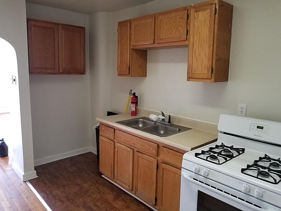 kitchen, refrigerator next to oven