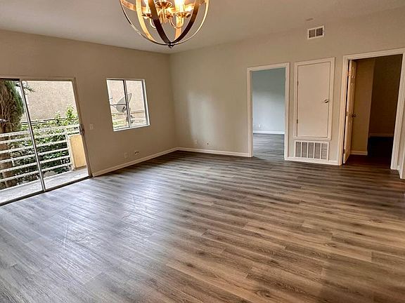 View from dining area of living room, balcony and two bedrooms
