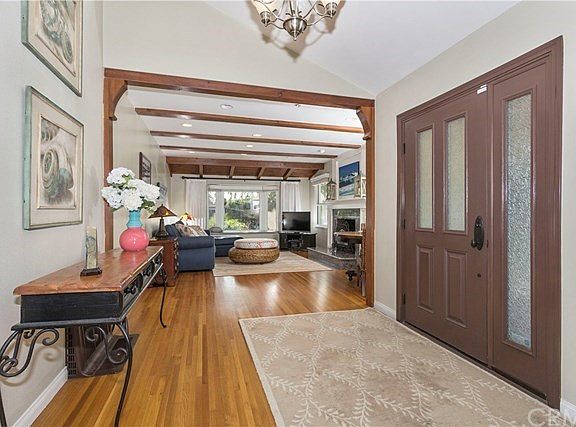 Raised ceiling entryway and lovingly cared for original hard wood floors on lower level.