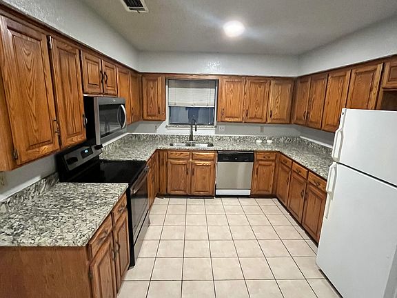 Large kitchen with new granite and stove