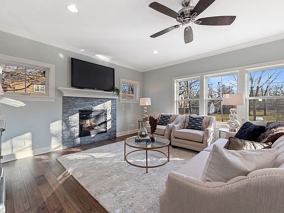 Family Room with Fireplace and south light that pours into the room...priceless!