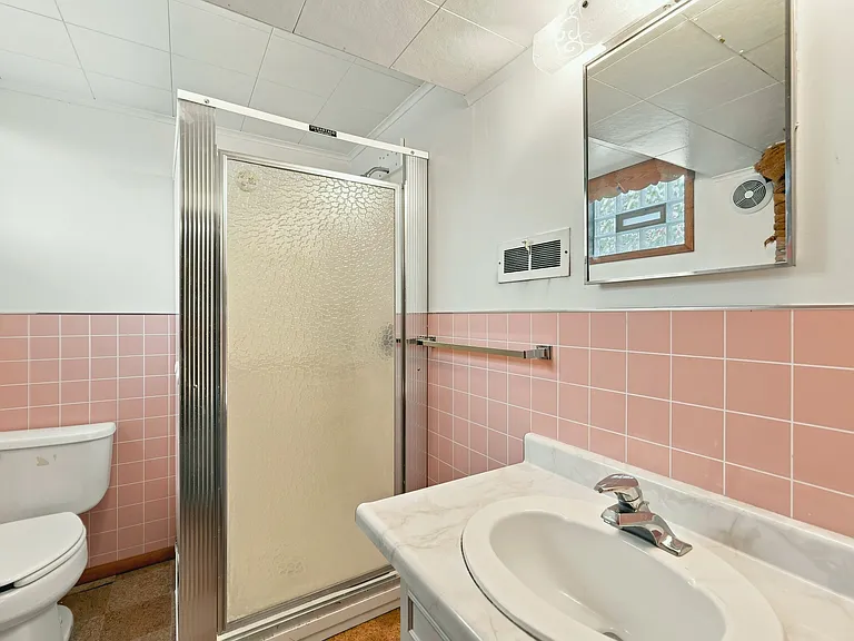 Bathroom with full sized shower, floor-to-ceiling armoire, medicine cabinet, and vanity drawers. Lots of storage for all your bathroom necessities!