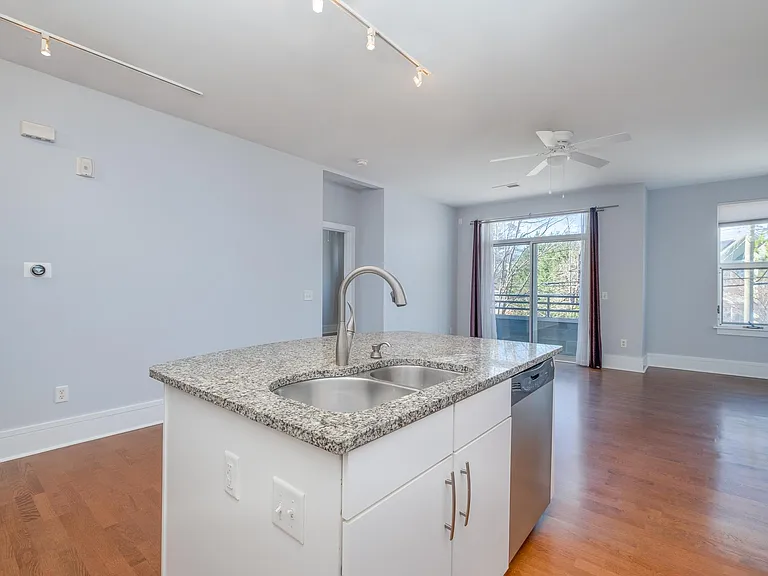 View of the kitchen island and living room from the kitchen