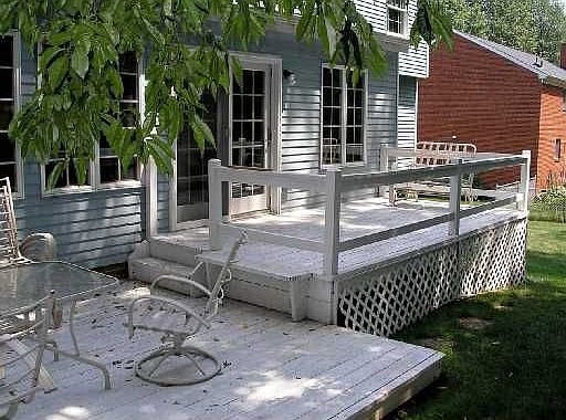 Multi-level rear deck overlooks the level back yard.