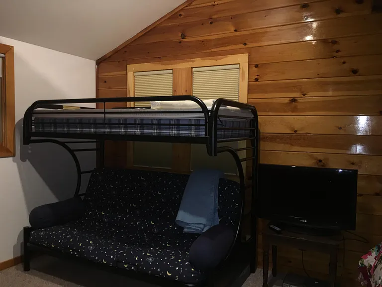 twin bunk bed on top with double-sized futon mattress on bottom