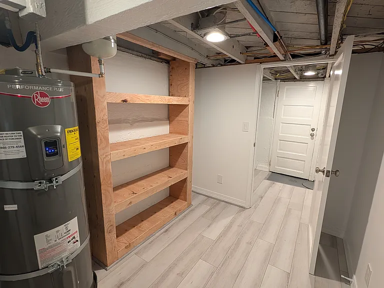 Downstairs storage shelving and mudroom. New water heater.