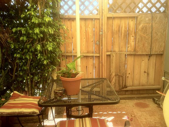 Front enclosed red brick patio