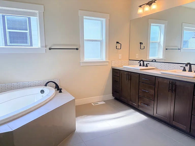 Spacious master bathroom with bathtub