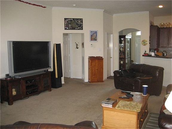 Large family room with gas fireplace and gas logs.
