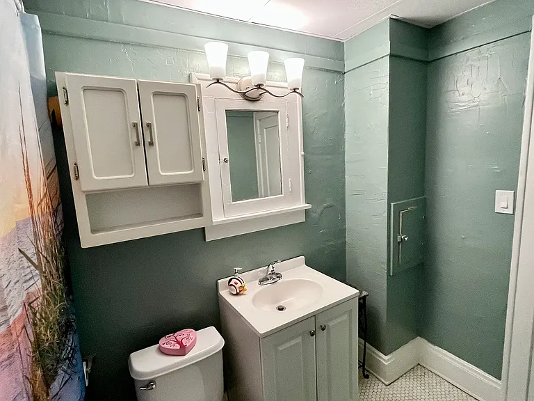 Bathroom with vanity and cloth chute