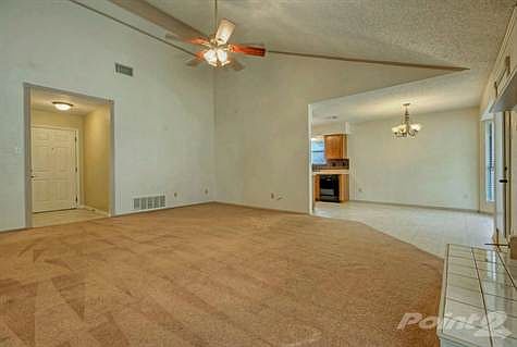 \nThe roomy great room, with its vaulted ceilings, large windows and handsome fireplace, is the perf