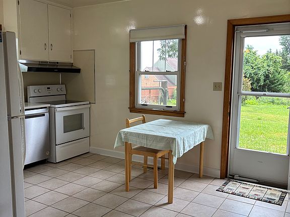 kitchen door on to the concrete patio, fenced in side garden
