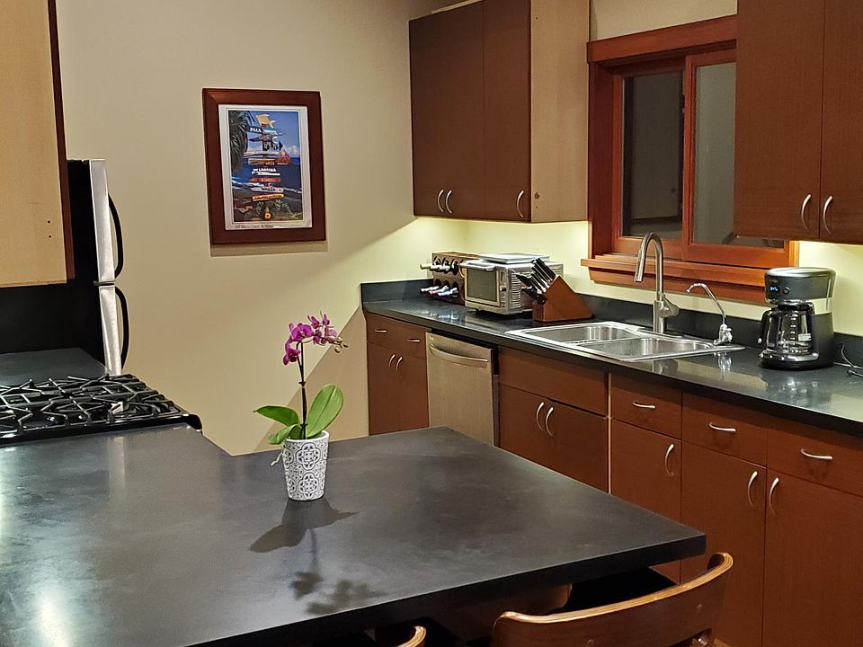 Kitchen with granite counter tops and openable skylight