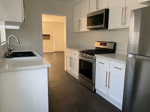 Kitchen: Full size new stainless steal appliances, Deep cabinets, Natural light.