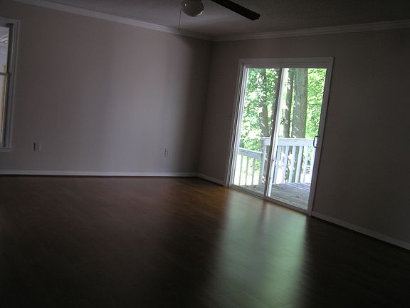 Great Room/Dinning Room Combo with back yard view from deck.