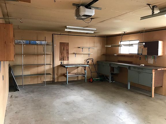 Detached garage with workshop/hobby area.