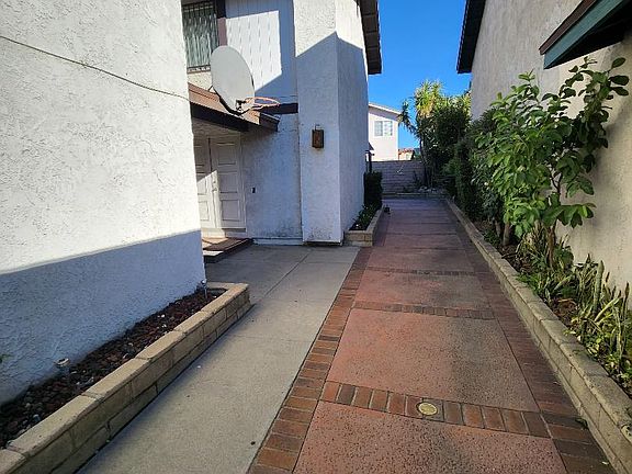 Side yard has concrete flooring
