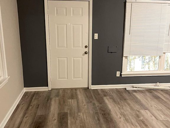 View 1 of living room with vinyl plank flooring installed throughout