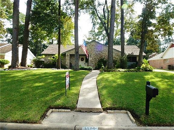 Amazing 1-story sitting on a large wooded landscaped lot