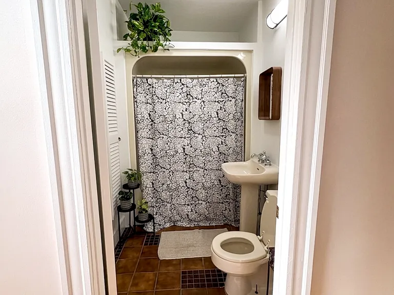 Newly painted bathroom with bathtub /
shower.