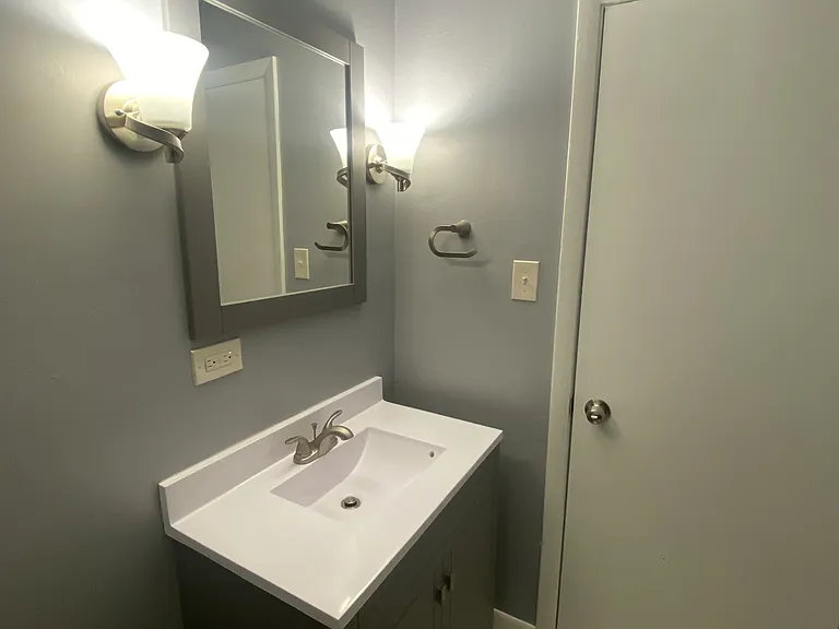 Bathroom w/ matching Vanity & Mirror Set, Kohler Toilet Seat and Meon Fixtures