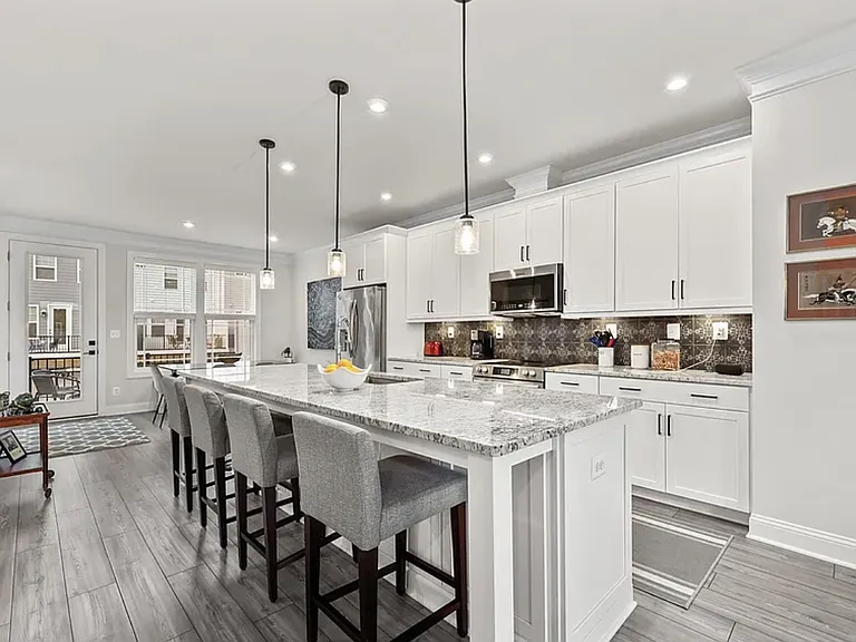 Oversized kitchen island includes stools for FOUR, pendent lighting. 4 grey stools provided