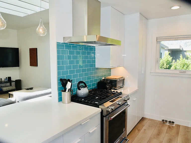 Kitchen with stainless steel hood