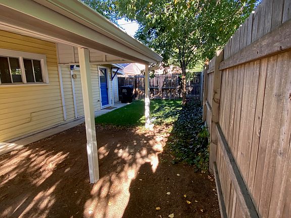 Small & intimate side yard beyond the carport
