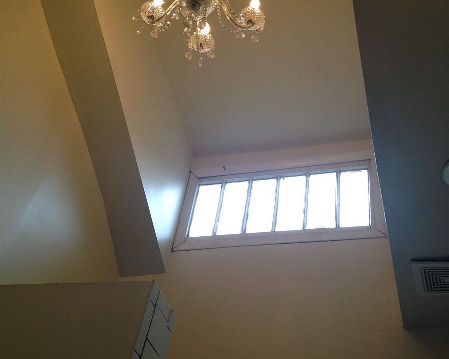 BATHROOM Chandelier on Cathedral ceiling with glass block wi